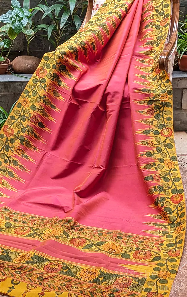 Peach kanchi silk saree with hand painted kalamkari motifs on mustard border
