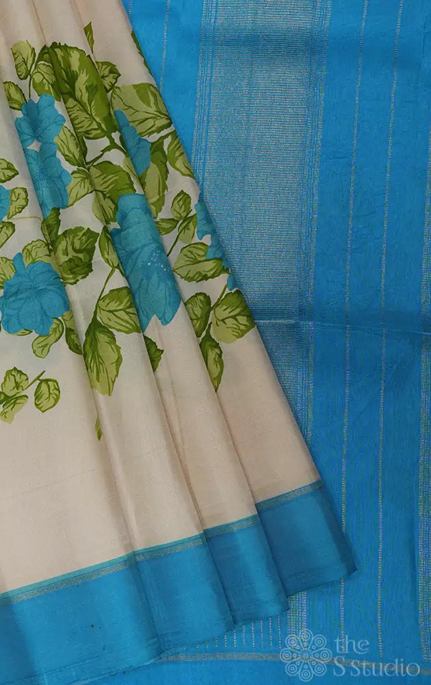 Off white kanchi silk saree with floral prints and blue border