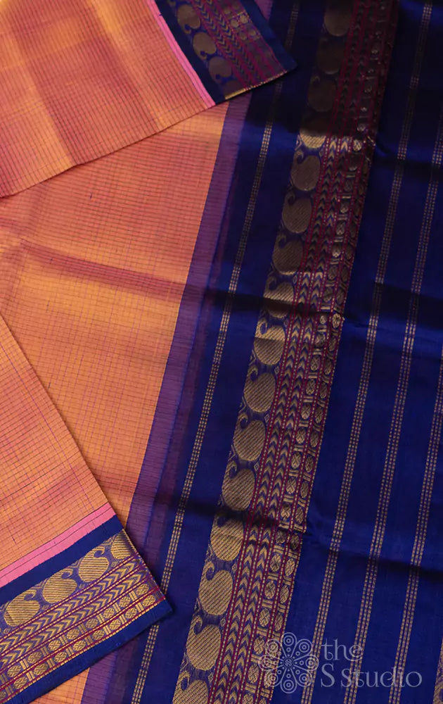 Light orange silk cotton saree with korvai violet border