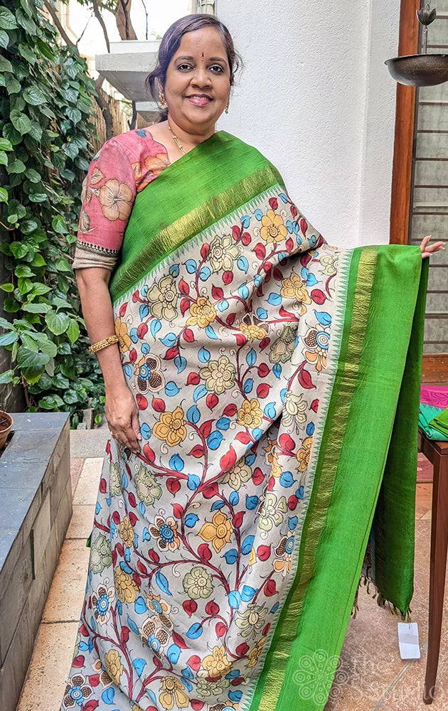 Grey pen kalamkari hand painted kanchipuram silk saree with parrot green border