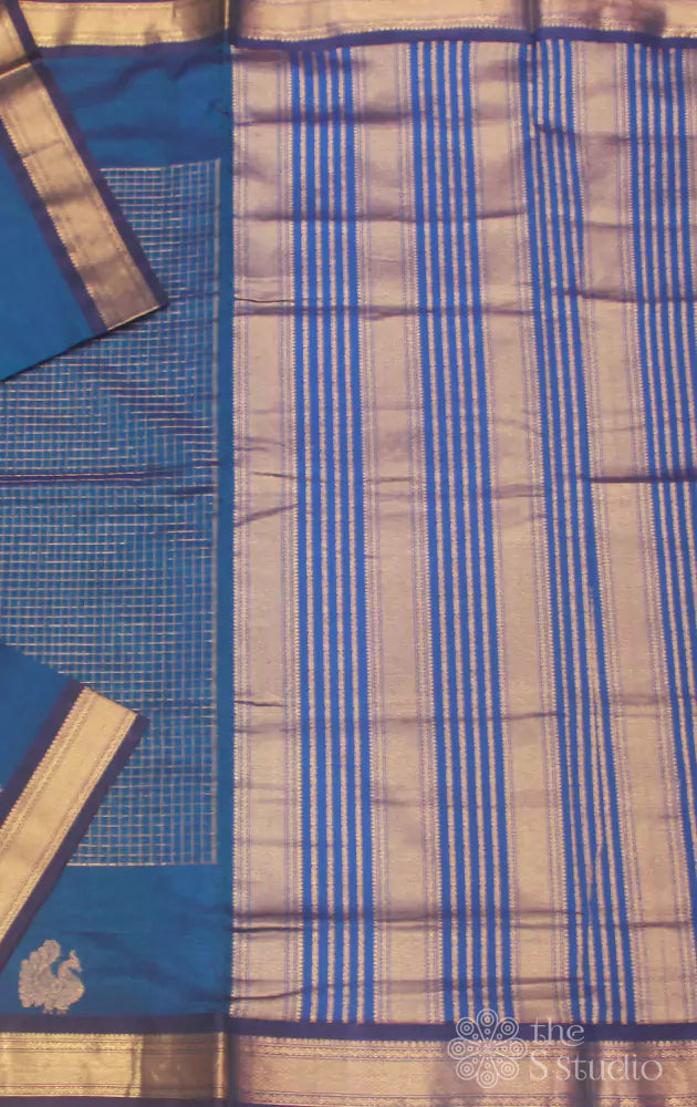 Bright blue silk cotton saree with zari checks and peacock motifs