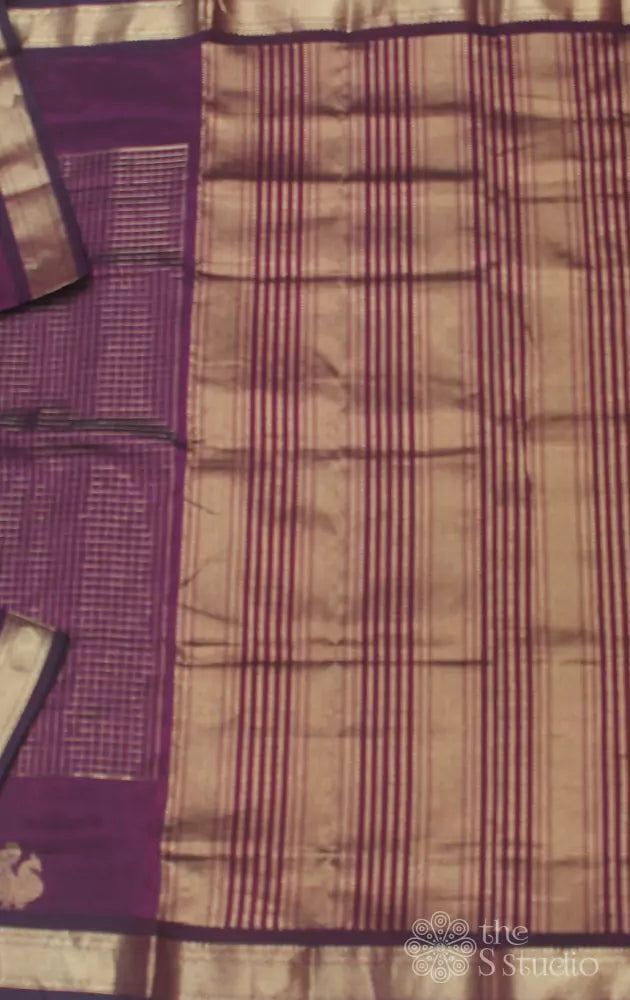 Maroon silk cotton saree with zari checks and peacock motifs