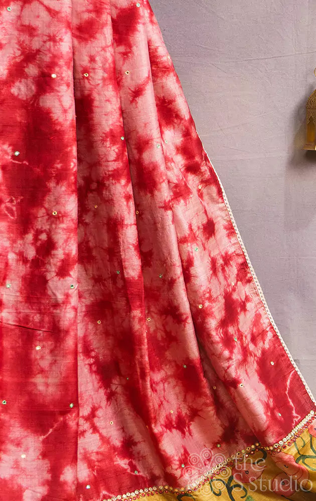 Red shibori tie and dye tussar silk saree with handpainted krishna on the pallu