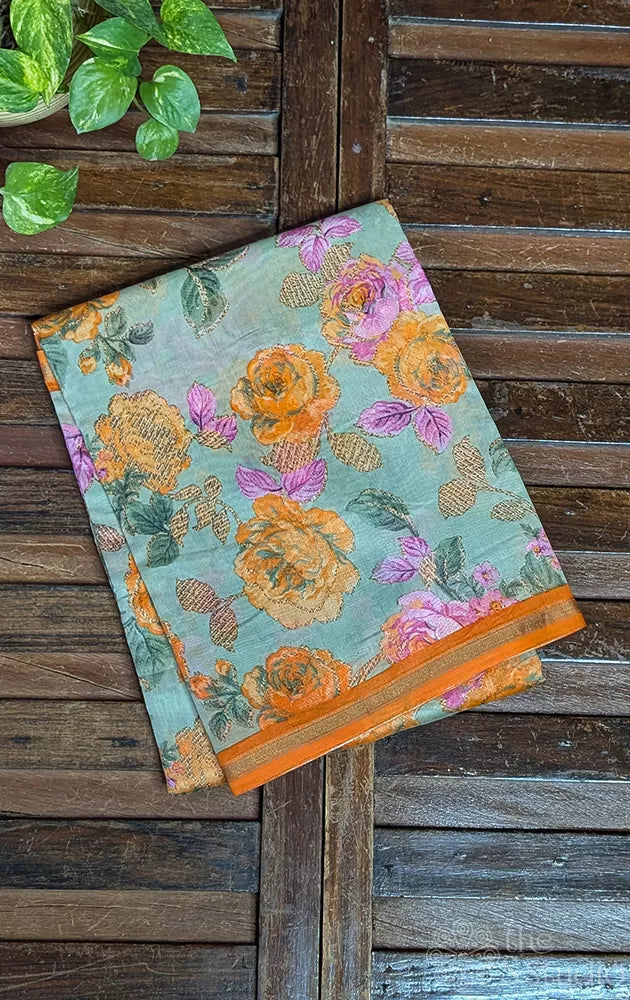 Pale green chanderi cotton saree with mustard floral prints