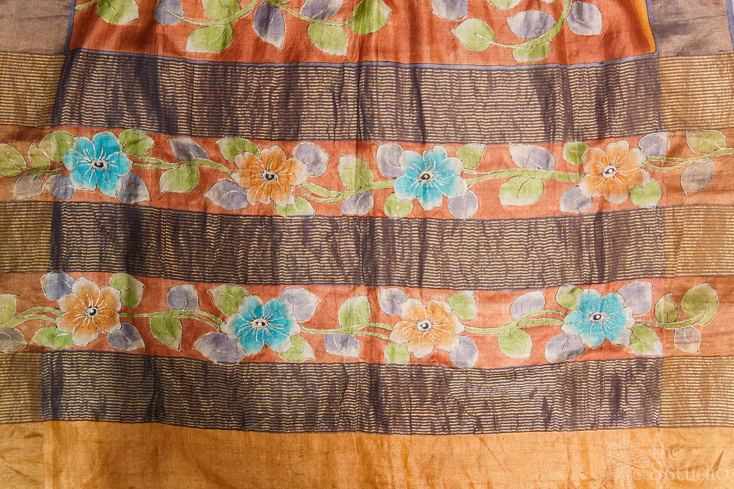 Brown tussar silk saree with floral prints and zari border