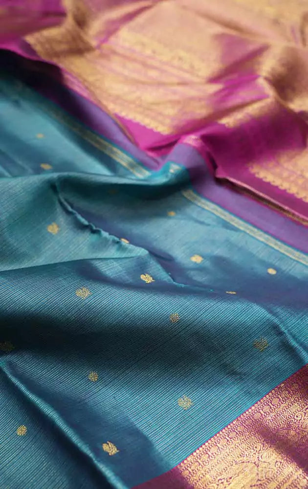 Rama blue vaira oosi kanchi silk saree with magenta pallu