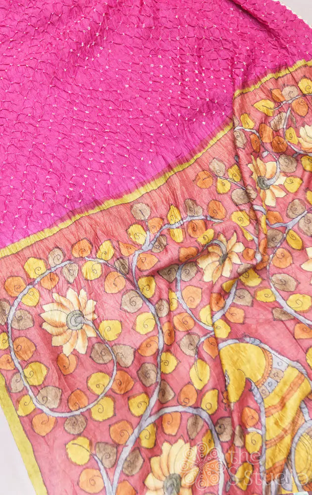 Pink tussar bandhani saree with maroon handpainted kalamkari pallu