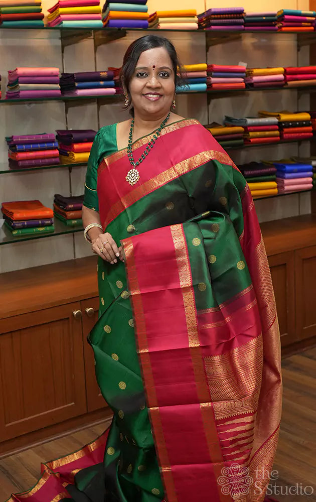 Emerald green kanjivaram silk saree with rettai pet red border