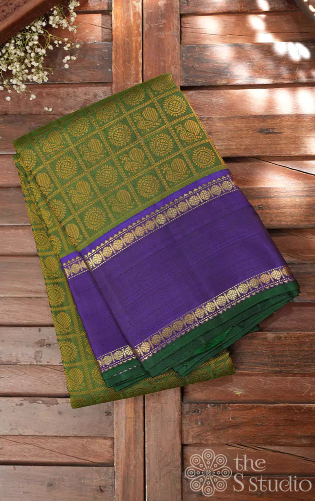 Chutney green kanchi silk saree with violet rettai pet border