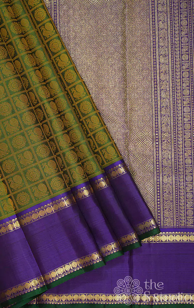 Chutney green kanchi silk saree with violet rettai pet border