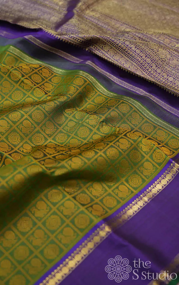 Chutney green kanchi silk saree with violet rettai pet border