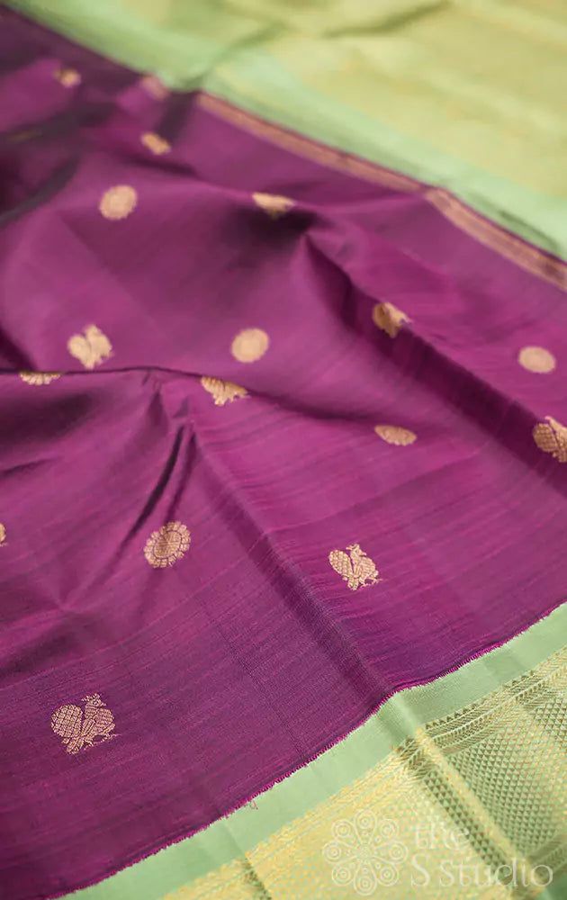 Deep purple kanjivaram saree with elachi green korvai border