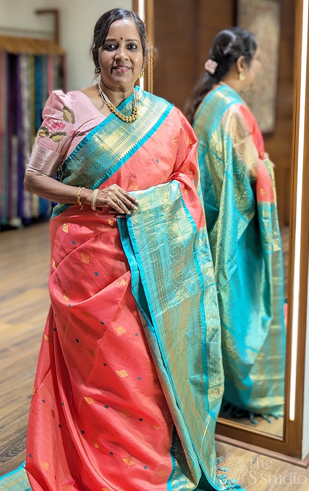 Peachish pink gadwal silk saree with teal blue border