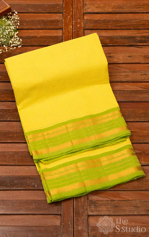 Yellow Gadwal cotton saree with all over checks and green pure silk zari border