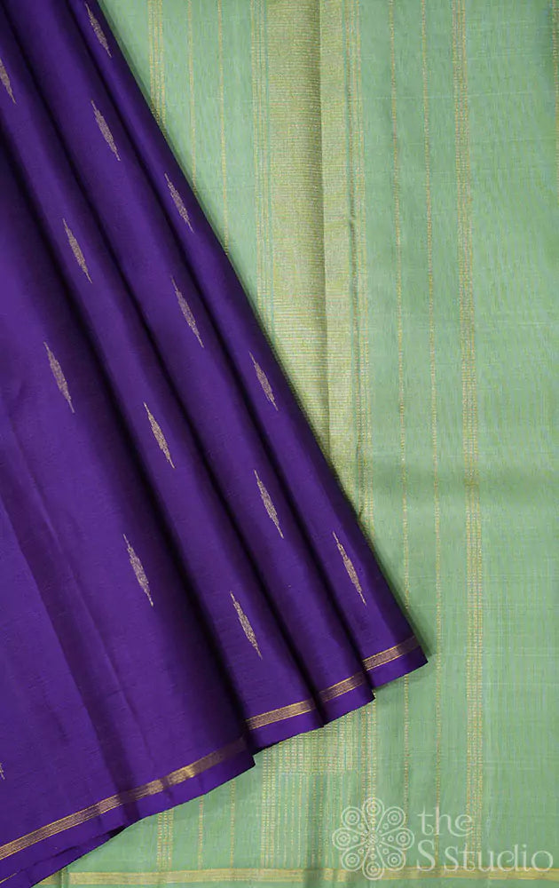 Violet kanchi silk saree with buttas and contrast elachi green pallu