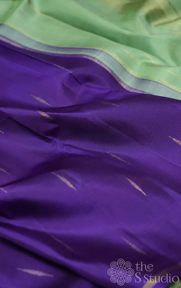 Violet kanchi silk saree with buttas and contrast elachi green pallu