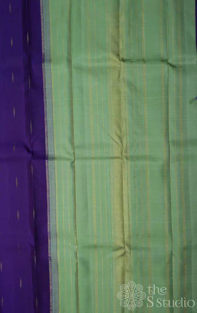 Violet kanchi silk saree with buttas and contrast elachi green pallu