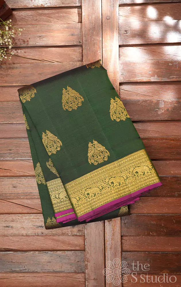 Bottle green kanchipuram silk saree with woven jodi kili zari motifs