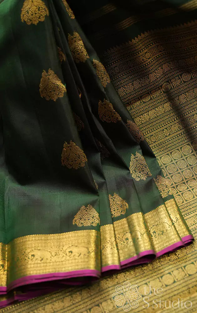 Bottle green kanchipuram silk saree with woven jodi kili zari motifs