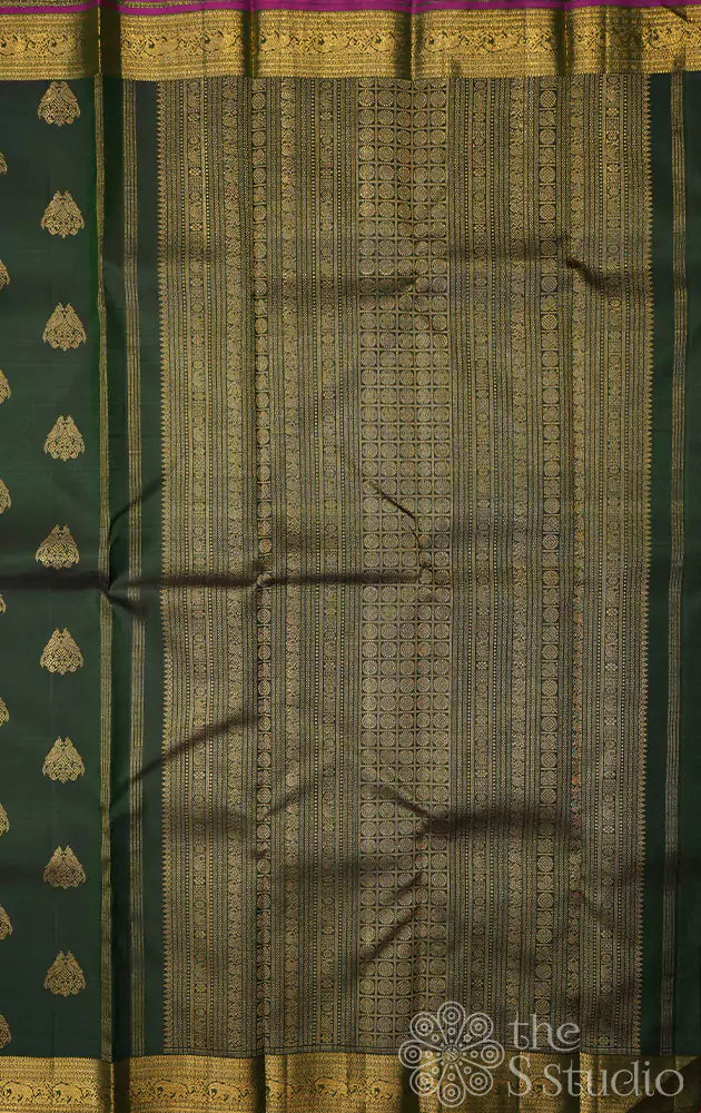 Bottle green kanchipuram silk saree with woven jodi kili zari motifs