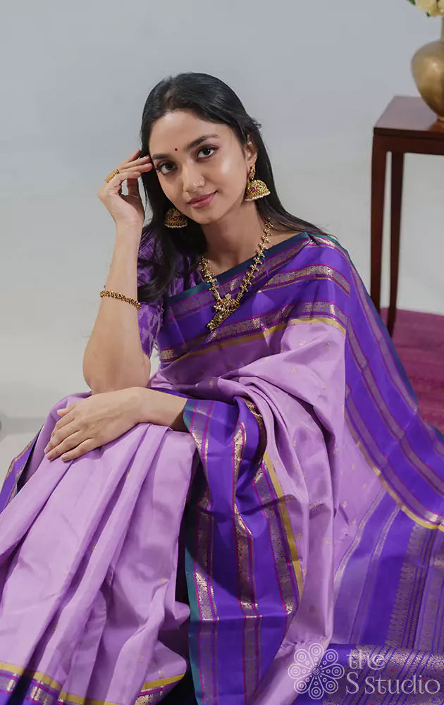 Lavender kanchipuram silk saree with korvai violet border woven with varisaipet design