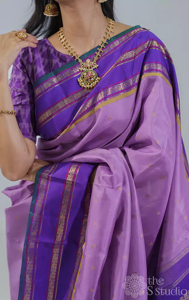 Lavender kanchipuram silk saree with korvai violet border woven with varisaipet design