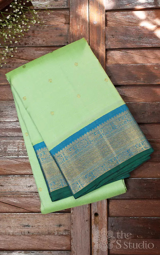 Pista green kanchi silk saree with korvai anandha blue border