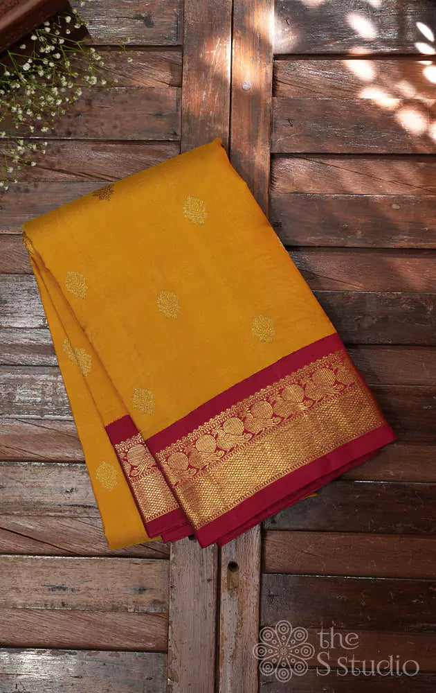 Mustard kanjivaram saree with korvai maroon border