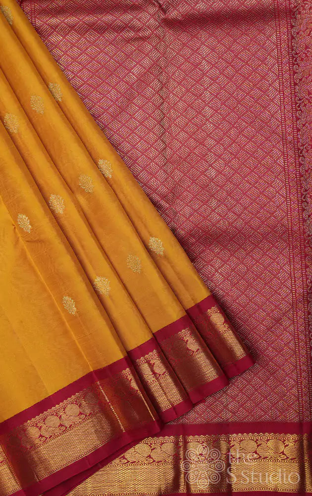 Mustard kanjivaram saree with korvai maroon border