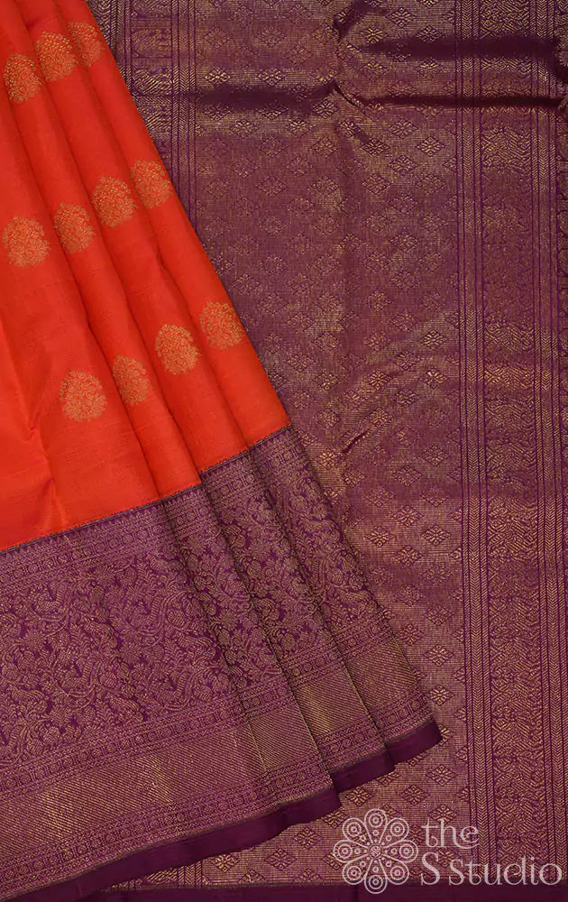 Burnt orange kanjivaram silk saree with a purple korvai border