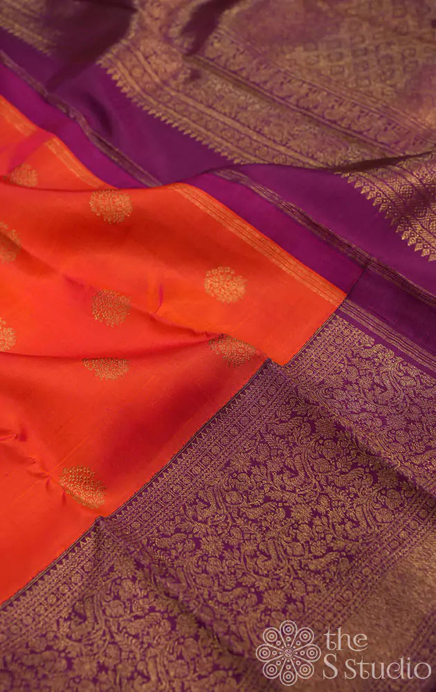 Burnt orange kanjivaram silk saree with a purple korvai border