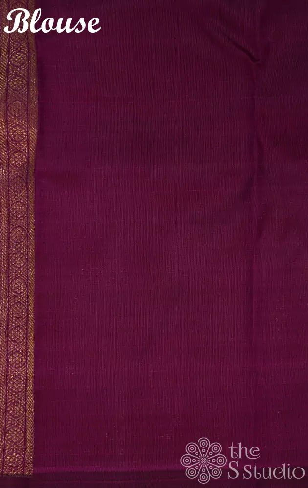 Burnt orange kanjivaram silk saree with a purple korvai border