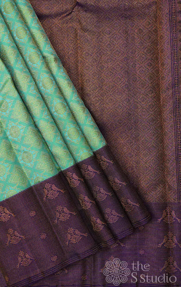 Sea green kanchi silk saree with violet border