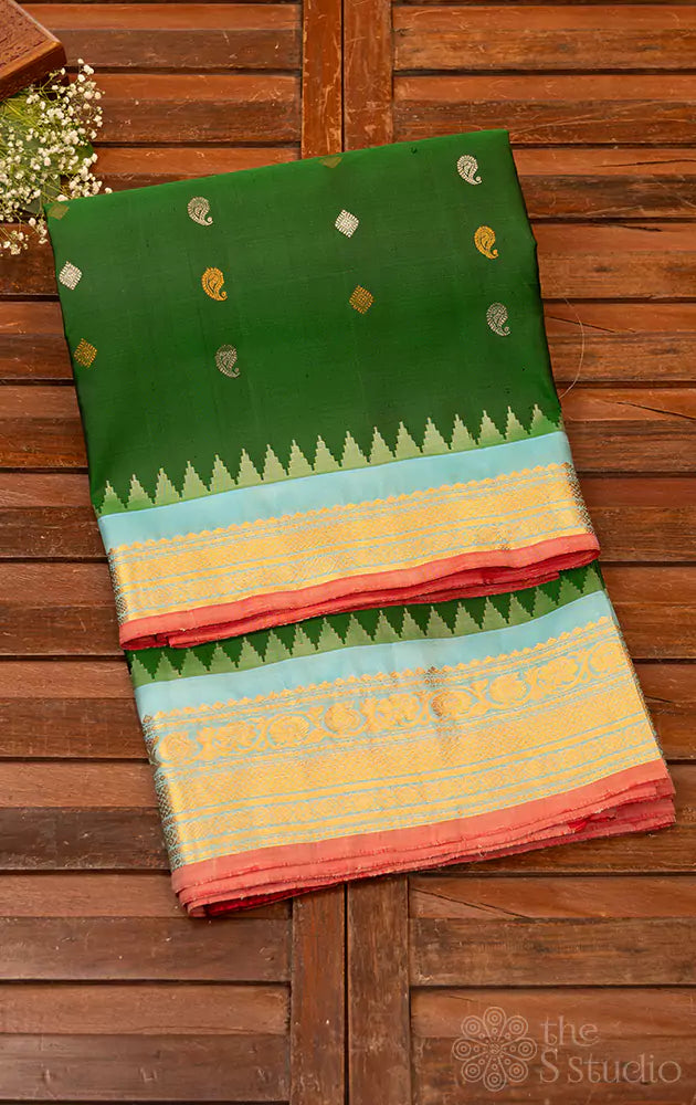 Bottle green Gadwal silk saree with light blue temple border