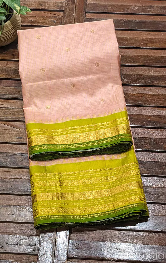 Light peach Gadwal silk saree with green temple border