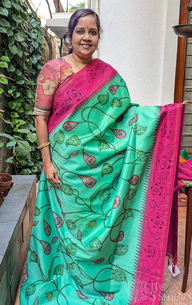 Sea green kanchi silk saree with all over handpainted kalamkari floral motifs
