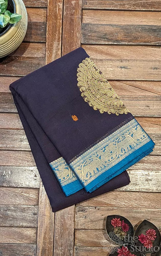 Dark purple Kanchi cotton saree with a sea blue border woven in zari.