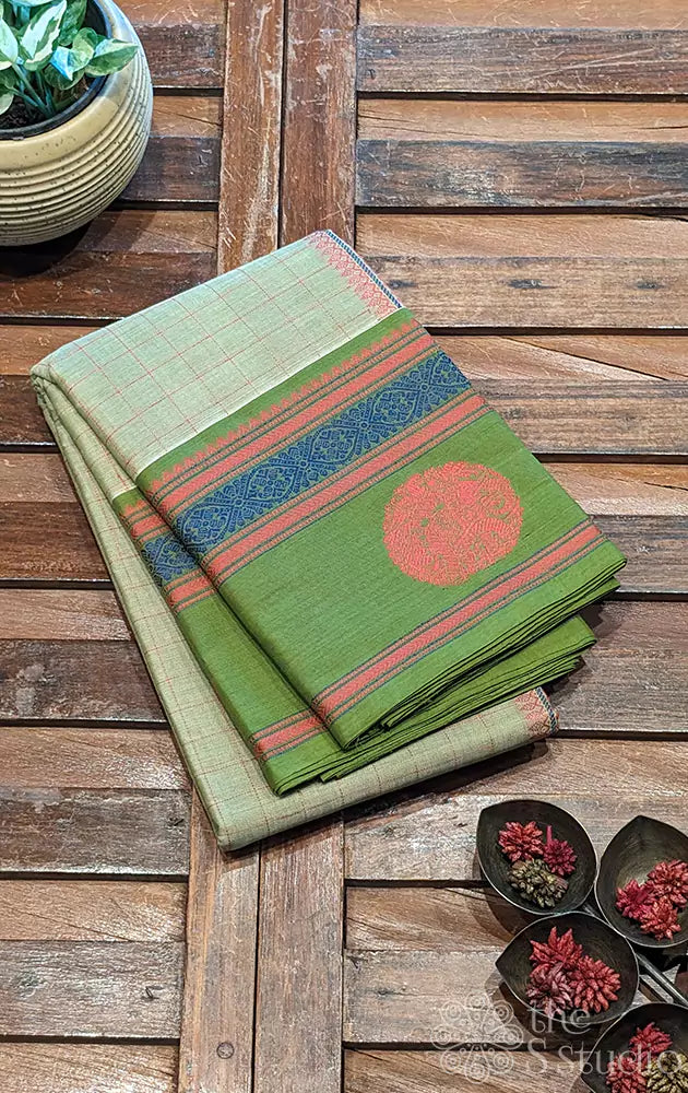 
Pastel green handwoven Kanchi cotton saree featuring a matching green border