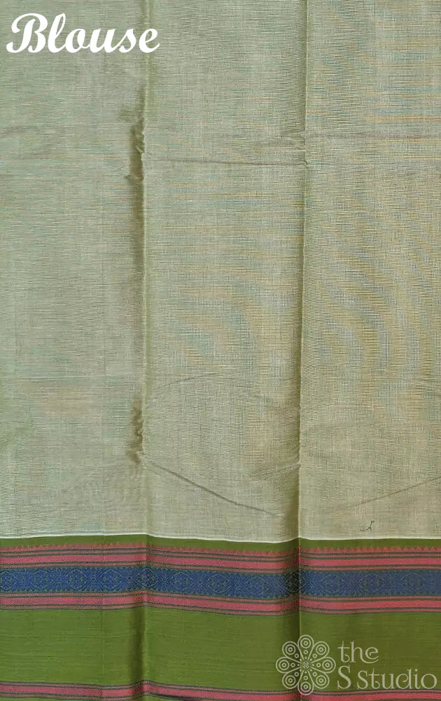 Pastel green handwoven Kanchi cotton saree featuring a matching green border