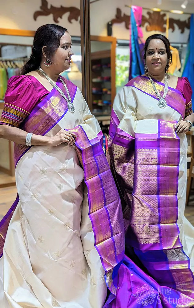 Off white kolam buttas Kanchipuram silk saree with purple border