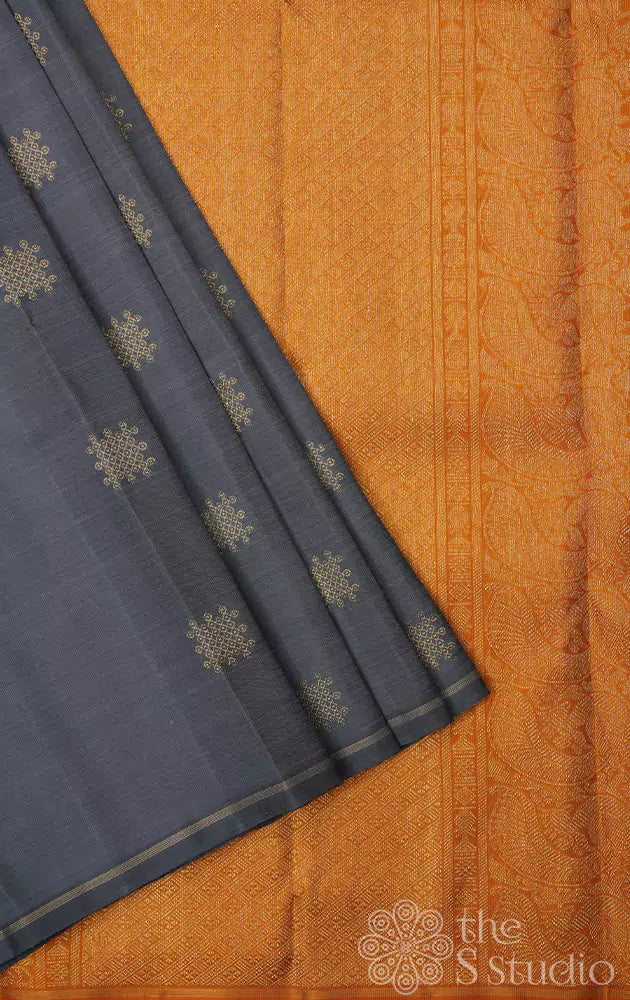 Slate grey kanchi silk saree with traditional kolam buttas woven in pure zari