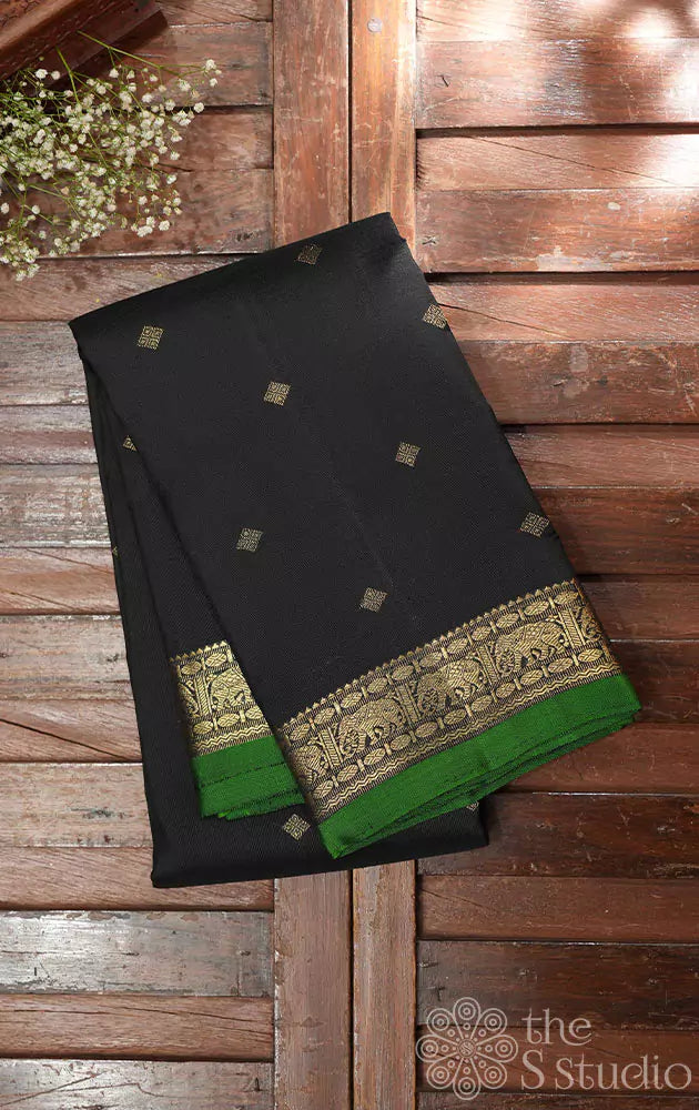 Black kanchi silk saree with green pallu
