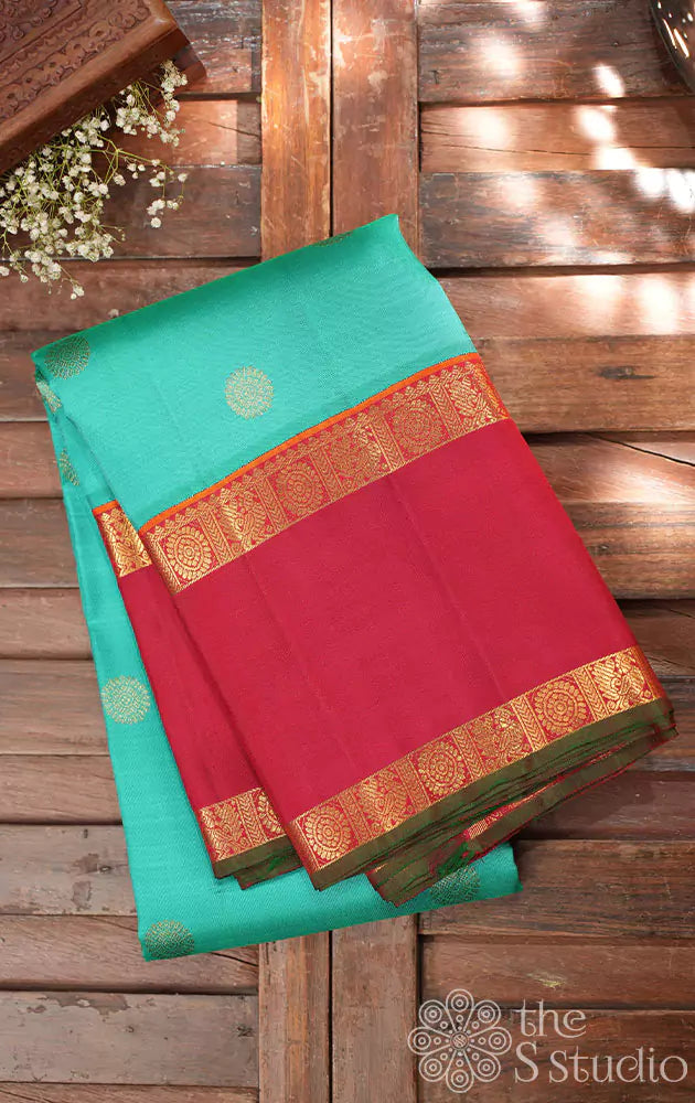 Sea green kanjivaram saree with red border