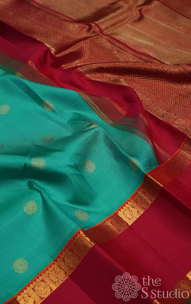 Sea green kanjivaram saree with red border