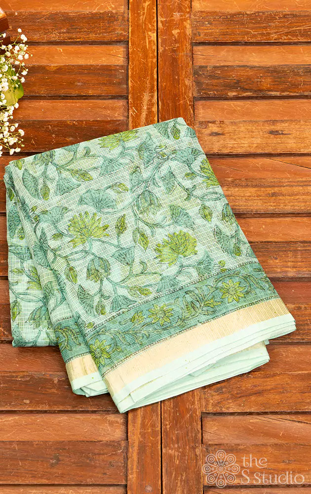 Light green kota cotton saree with floral veins and zari border