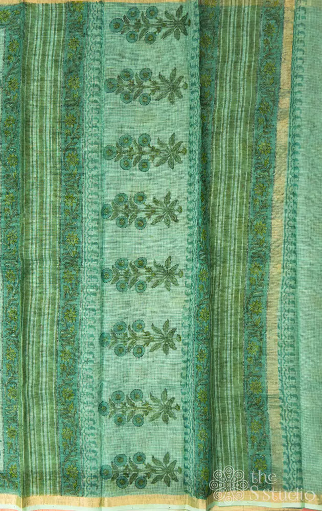 Light green kota cotton saree with floral veins and zari border