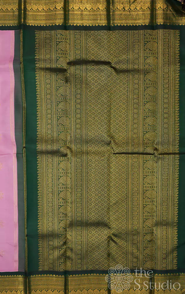 Pink Kanchipuram silk saree with korvai green border