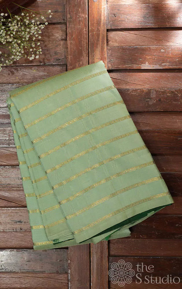 Elachi green kanchi silk saree with zari parallel lines on the body and a contrast green pallu