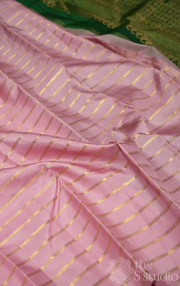 Onion pink kanchi silk saree with zari parallel lines on the body and a contrast green pallu