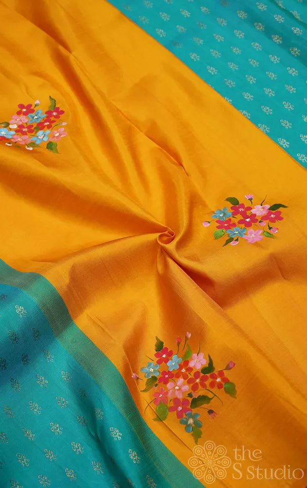 Mustard and aqua blue hand painted kanchipuram silk saree with party pallu